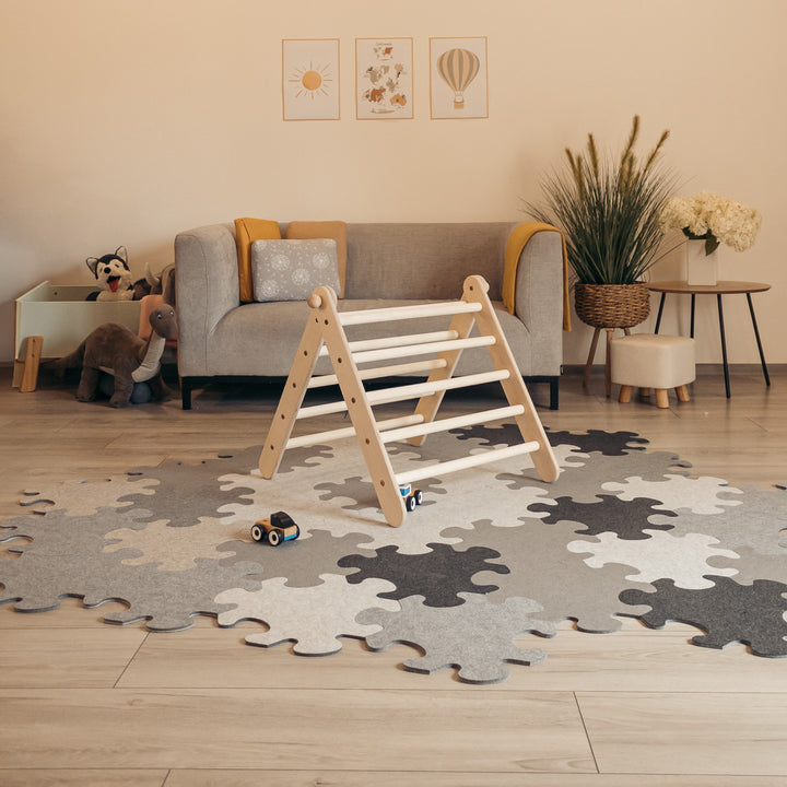 Children's climbing structure known as Adjust up triangle.The climbing structure is made of wood and is shown in a 60 degree angle position.