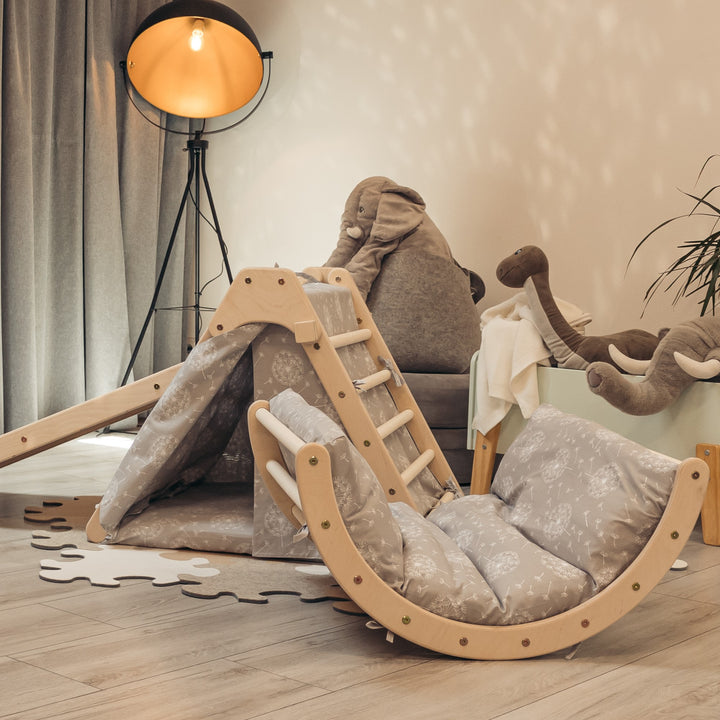 Children's foldable triangle playset with a sliding board, a small arch, mattresses and a tent