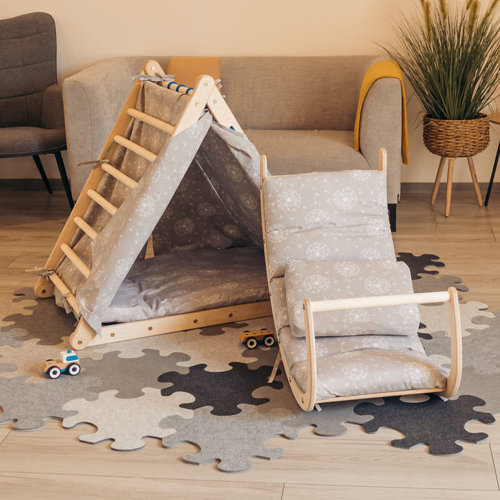 Children's climbing set with accessories including a triangle, sliding board, rocking toy, tent, and two mattresses.